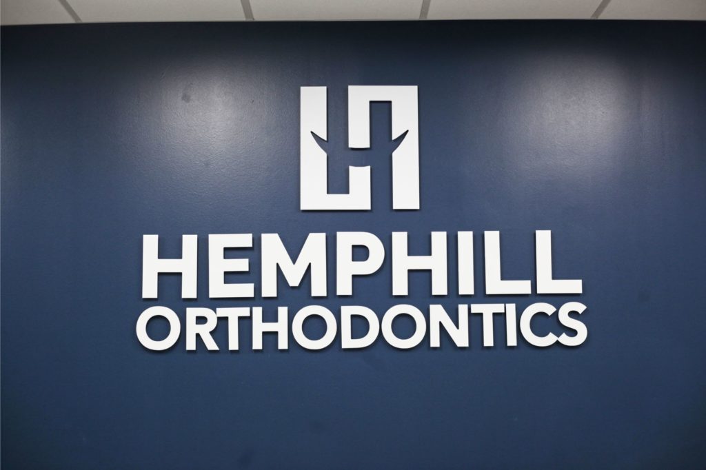 Hemphill Orthodontics logo on wall